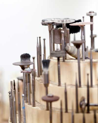 Image of wooden tool rack carousel holding drill bits and buffs