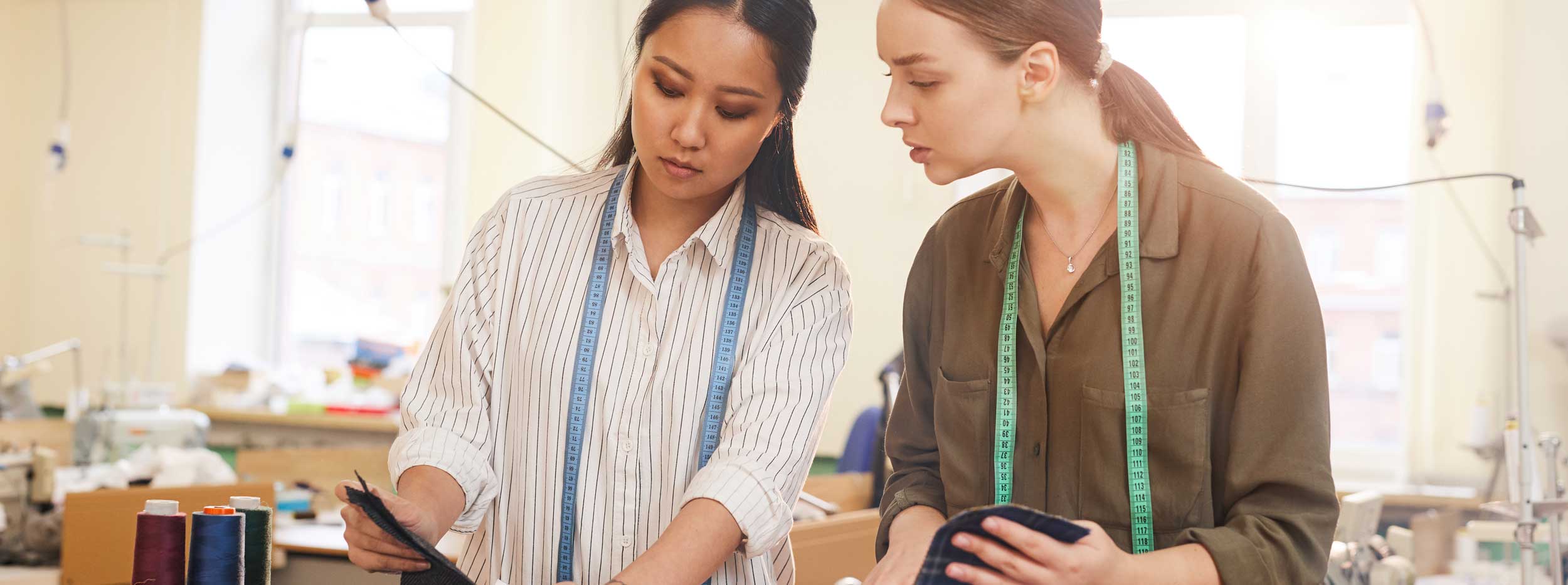 Two designers selecting fabric.